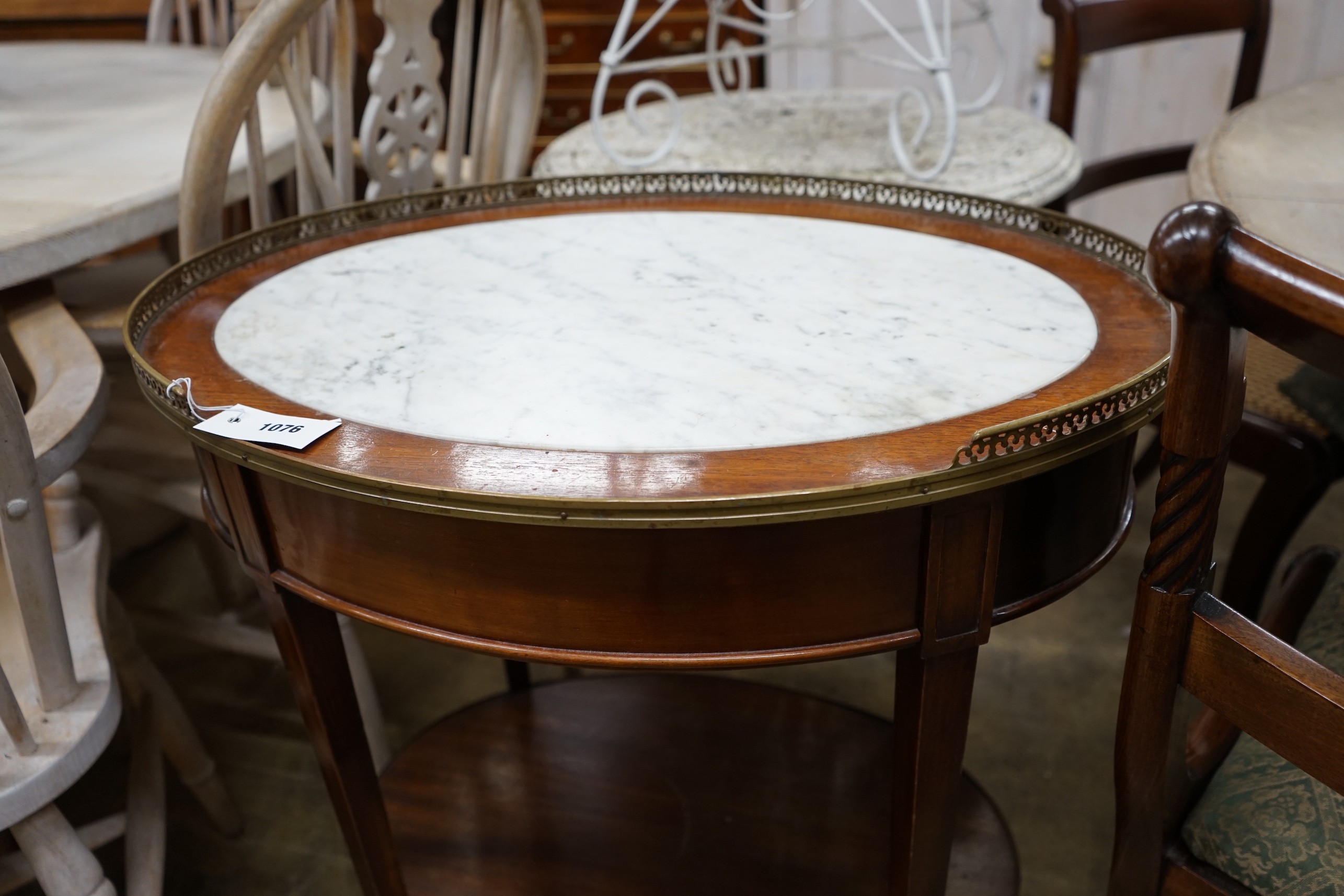 A French oval mahogany marble top two tier centre table, width 68cm, depth 48cm, height 75cm